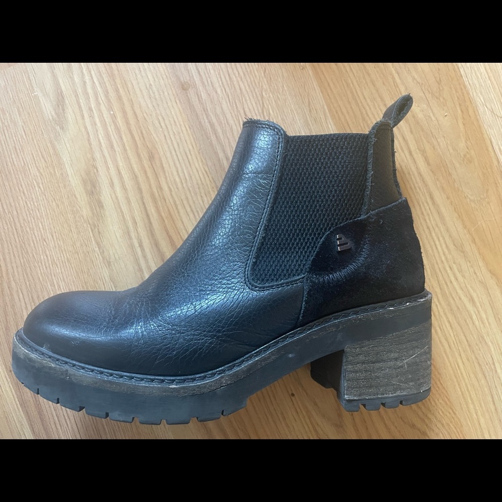 Slightly worn black ankle booties. Super comfy due to rubber heel on bottom.